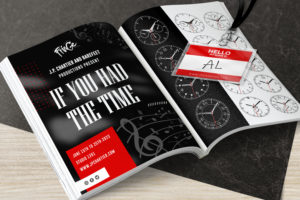 An open book with music notes and clocks in the background that reads "If You Had The Time" and a name tag that reads "Hello my name is AL". The book is black and white and laid down on the floor.