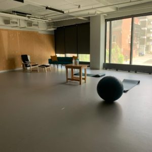 a studio room with yoga balls and chairs